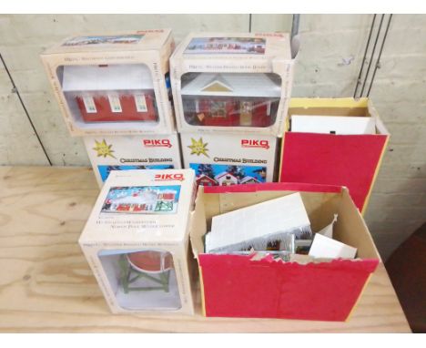 A group of seven Piko Christmas G scale model railway buildings.  