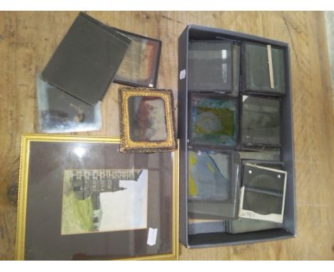 A collection of magic lantern glass slides, old photorgraphs and wateroclour.  