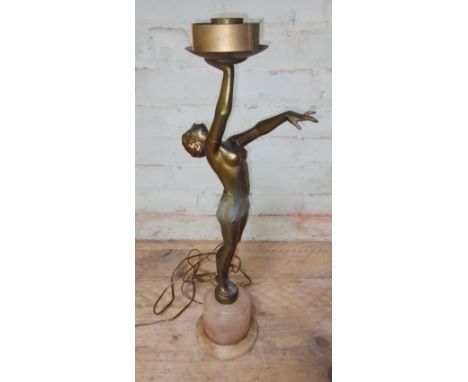 An Art Deco gilt spelter lamp modelled as a semi nude female figure on alabaster base, height 55cm.Condition:- General wear t