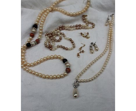 A pair of pearl and ruby set earrings together with pearl and yellow metal drop earrings, simulated pearl necklaces, faux pea