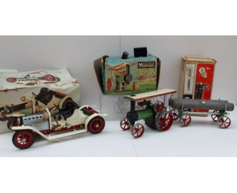 A Mamod steam traction engine T.E.1A reversing, together with a Mamod lumber wagon LW.1 and a Mamod Steam roadster 