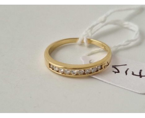 A diamond channel set half eternity ring 18ct gold size P 2.7 gms