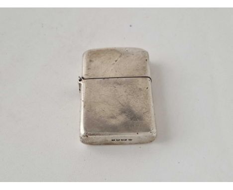 A heavy silver cigarette lighter, 2.25 inches high, London 1968