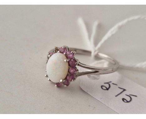 A opal and pink stone ring one stone missing 9ct size R 2.4 gms