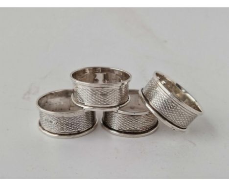 A set of four engine turned napkin rings with vacant cartouche, Birmingham 1939, 27g