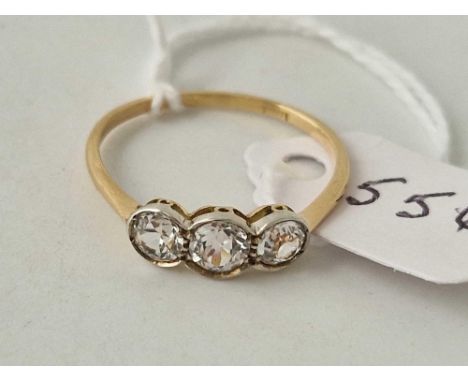 A threes stone ring 18ct gold size Q 1.8 gms
