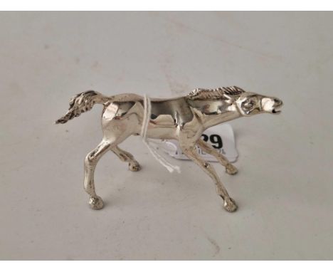 A standing model of a horse, 3" long, 50g