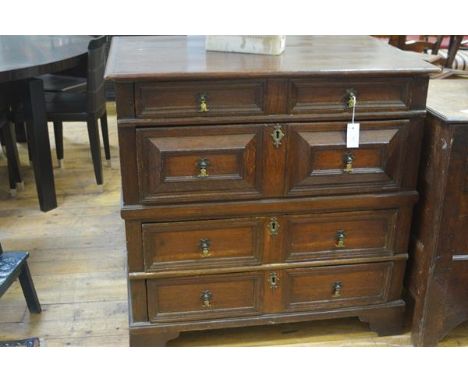 A William and Mary oak chest of drawers, c. 1700, the rectangular top above four moulded long drawers, raised on (later) brac
