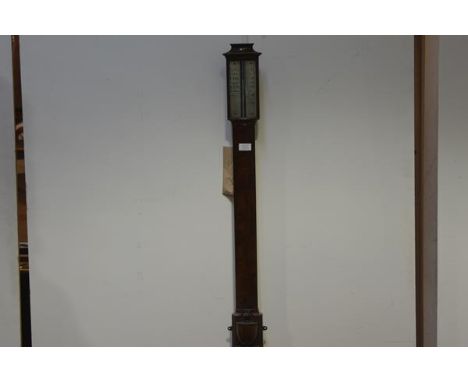 A George III mahogany stick barometer, early 19th century, the concave moulded crest over a bowed glass enclosing a silvered 