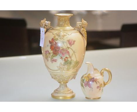 A Royal Worcester twin-handled vase, in blush ivory, of ovoid baluster form, painted with floral sprays and with wing and sca