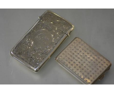 A George V silver card case, Mappin & Webb, Birmingham 1924, with engine turned decoration and gilt interior; together with a