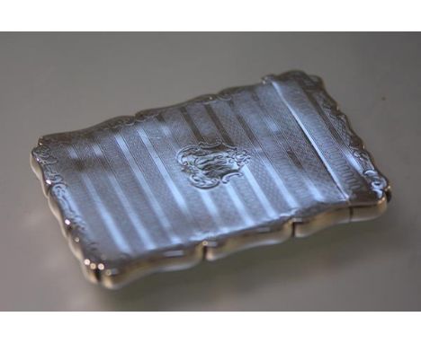 A 19th century silver-plated card case, with scalloped rim, engine turned bands and engraved with a monogram. 9.75cm by 6.75c