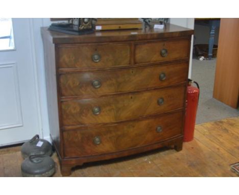 A George III mahogany bowfronted chest of drawers, with two short over three long graduated cockbeaded drawers, raised on sha