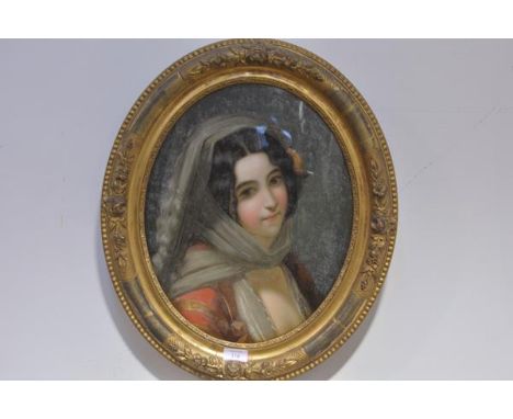 19th Century School, Portrait of a Young Girl with a Rose in her Hair, reverse painting on glass, oval, within a gilt-composi