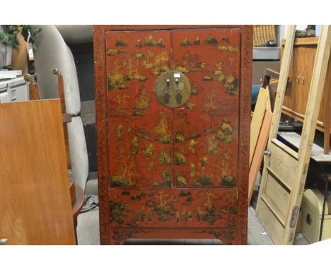 A Chinese lacquered and painted elm marriage cabinet, fitted with a pair of doors decorated with figures and pavilions in a m