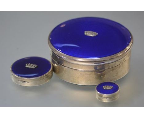 A matched set of three 1930's silver and blue enamel boxes, the largest, a jewellery box, of circular form, the royal blue en