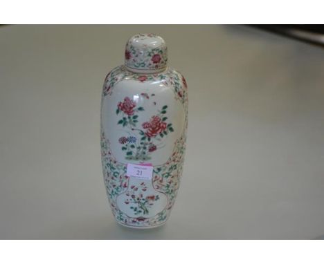 A Chinese porcelain jar and cover, of baluster form, with domed cover, painted in the famille rose palette with cartouches of