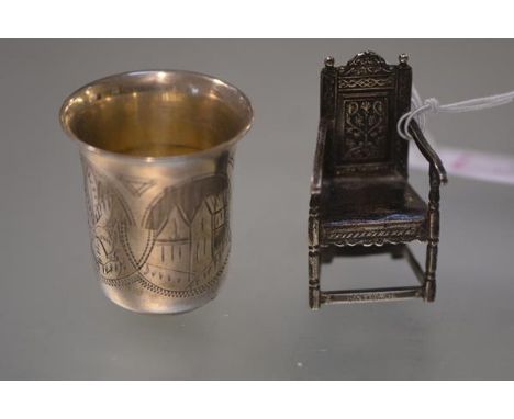 A Russian silver vodka cup or measure, late 19th century, engraved with cartouches of buildings and leaves, stamped marks inc