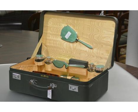 An Edward VIII lady's vanity case, by Mappin & Webb, the (partially) fitted interior with silver and engine-turned green enam