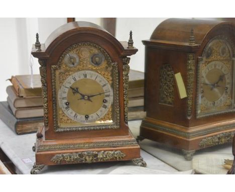 A late 19th century gilt-metal mounted oak bracket clock, the dome-top case enclosing a conforming gilt dial with silvered ch