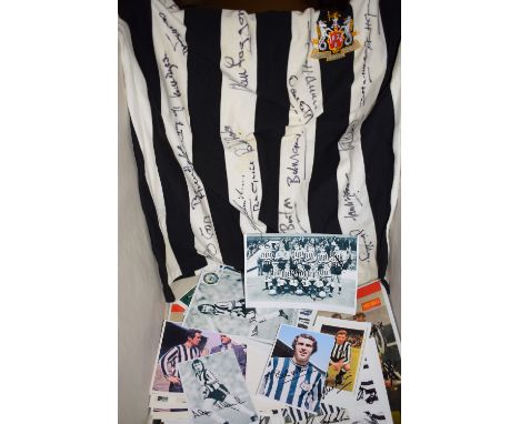 An autographed Newcastle United Football Club shirt; together with autographed photographs of Newcastle United players.