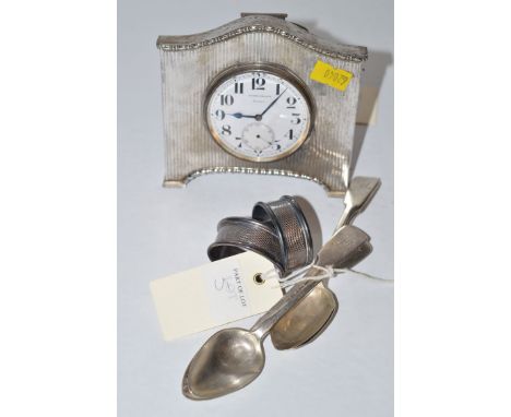 A silver mounted dressing table clock, by Walker & Hall, Sheffield 1927, with engine turned and beaded decoration around arab