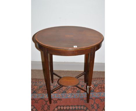 An Edwardian oval inlaid mahogany two-tier occasional table, raised on slender tapering legs.