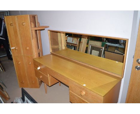 A modern oak kneehole dressing table, with long rectangular swing mirror over five drawers; together with a matching chest of