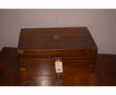 A Victorian rosewood brass mounted table writing box with fitted interior.