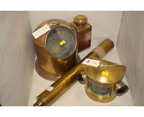 A boat compass in a brass binnacle; a brass navigation lamp; together with a brass telescope.