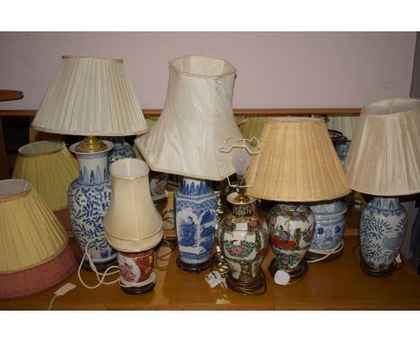 Seven modern Oriental table lamps and shades.