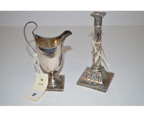 A silver helmet form cream jug, maker's mark worn, London 1824, with beadwork embossed rim, engraved initials under spout; to