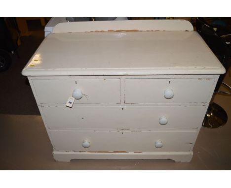 A 19th Century cream painted pine chest of two short and two long drawers with ceramic handles, on cutaway plinth base.