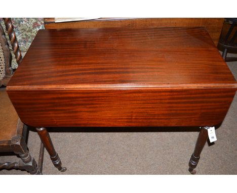 A Victorian mahogany Pembroke table, raised on turned legs with ceramic castors.