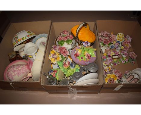 A large collection of miscellaneous decorative ceramic floral ornaments; bowls; vases; and similar decorative china, in four 