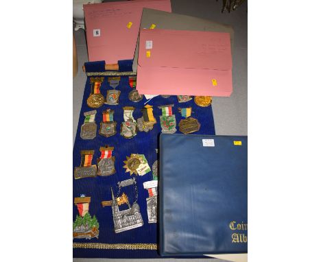 A collection of first day covers in three folders; a collection of pre decimal coins in an album; and a collection of modern 