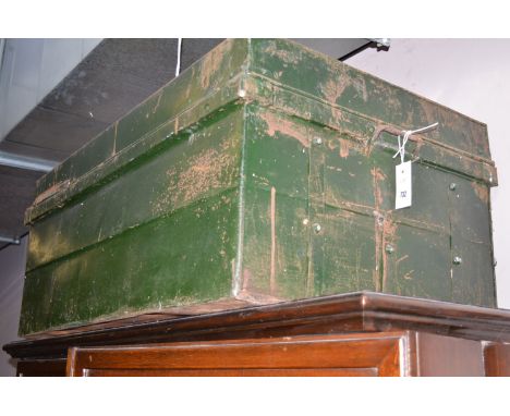 A large green painted metal trunk; and another black painted metal trunk.