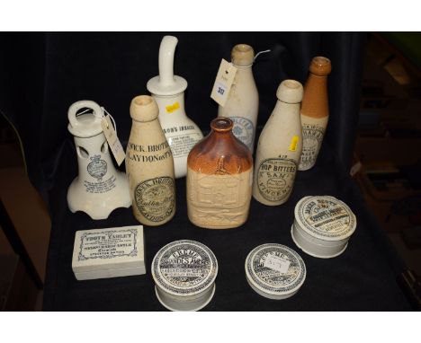 A collection of stoneware bottles and pots, including: Dr. Nelson's Inhaler; a stoneware flask titled 'The Colliers Inn'; fou