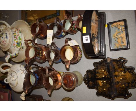 A collection of nine copper lustre jugs, various and two antique ceramic teapots and a compote; an early 20th Century Japanes