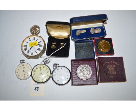 Three steel cased pocket watches, one by Syma, with broad arrow mark to back; a pair of silver cufflinks; two commemorative c
