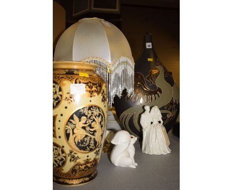 A brass table lamp with 1930's style beaded shade; a modern ceramic Studio vase depicting a bird with outspread wings; a Coal