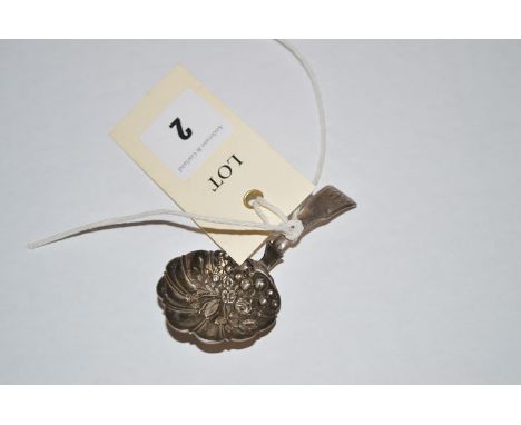 A George III silver caddy spoon, by S.P., Birmingham 1814, embossed with fruit and flowers to bowl.