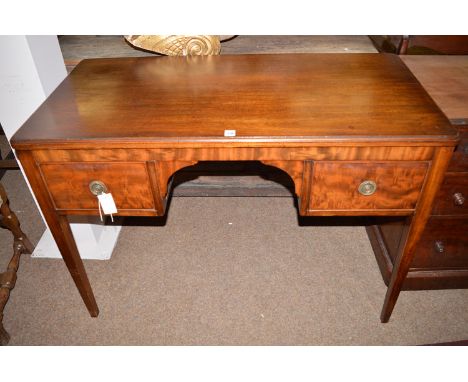 A reproduction mahogany dressing/side table, with moulded edge and rounded corners, fitted two shallow drawers with brass rin