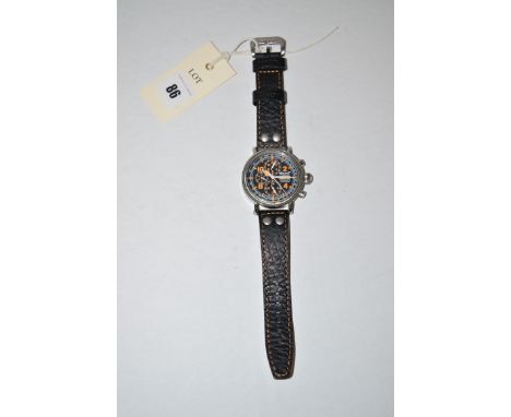 An Ingersoll automatic wristwatch, the baton and orange coloured arabic dial with day/date aperture and three subsidiary dial
