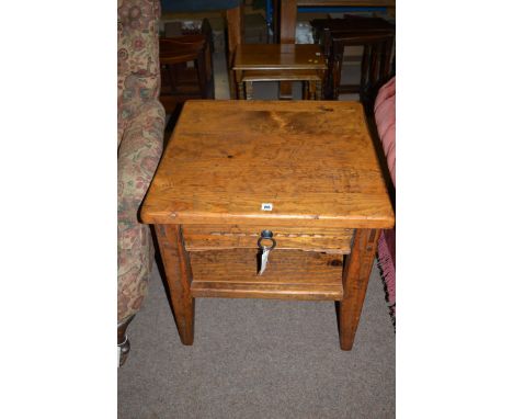 A square pine two-tier occasional table fitted a single drawer, raised on tapering legs.