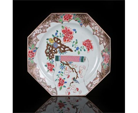 Chinese Qianlong charger in famille rose pallet with a scroll, bird and flowers of octagonal form, with restoration 29.5cm di