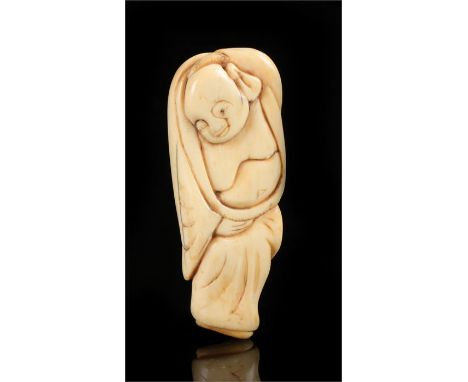 Japanese 18th Century ivory netsuke, carved as sleeping Hotei, 6.5cm long