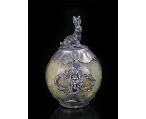 Chinese jade sphere mounted in white metal, with dragons and surmounted by a hare. signed to the base. overall height 55mm