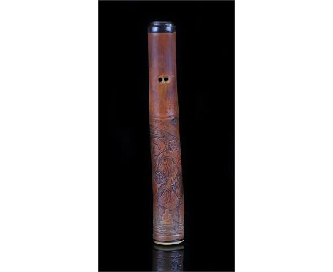 Otoshizutsu type pipe case of bamboo carved with a figure holding a parasol and various tools, a dog at his feet and monkey a