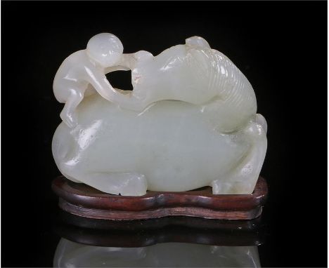 19th Century Chinese jade, carved as a recumbent horse and monkey group with hardwood stand. Height 35mm 